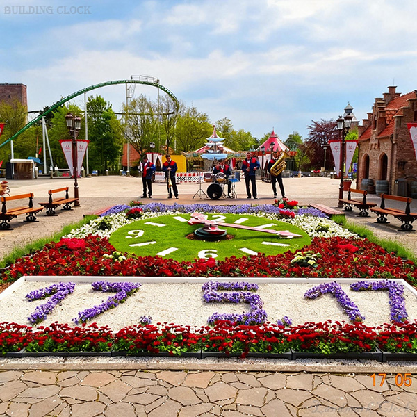 7. Floral clock with protective low fence for crowd control and planting protection 7. Floral clock with protective low fence for crowd control and planting protection