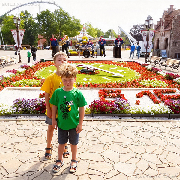 10. Landscape flower clock with gravel message panel and planted numerals 10. Landscape flower clock with gravel message panel and planted numerals